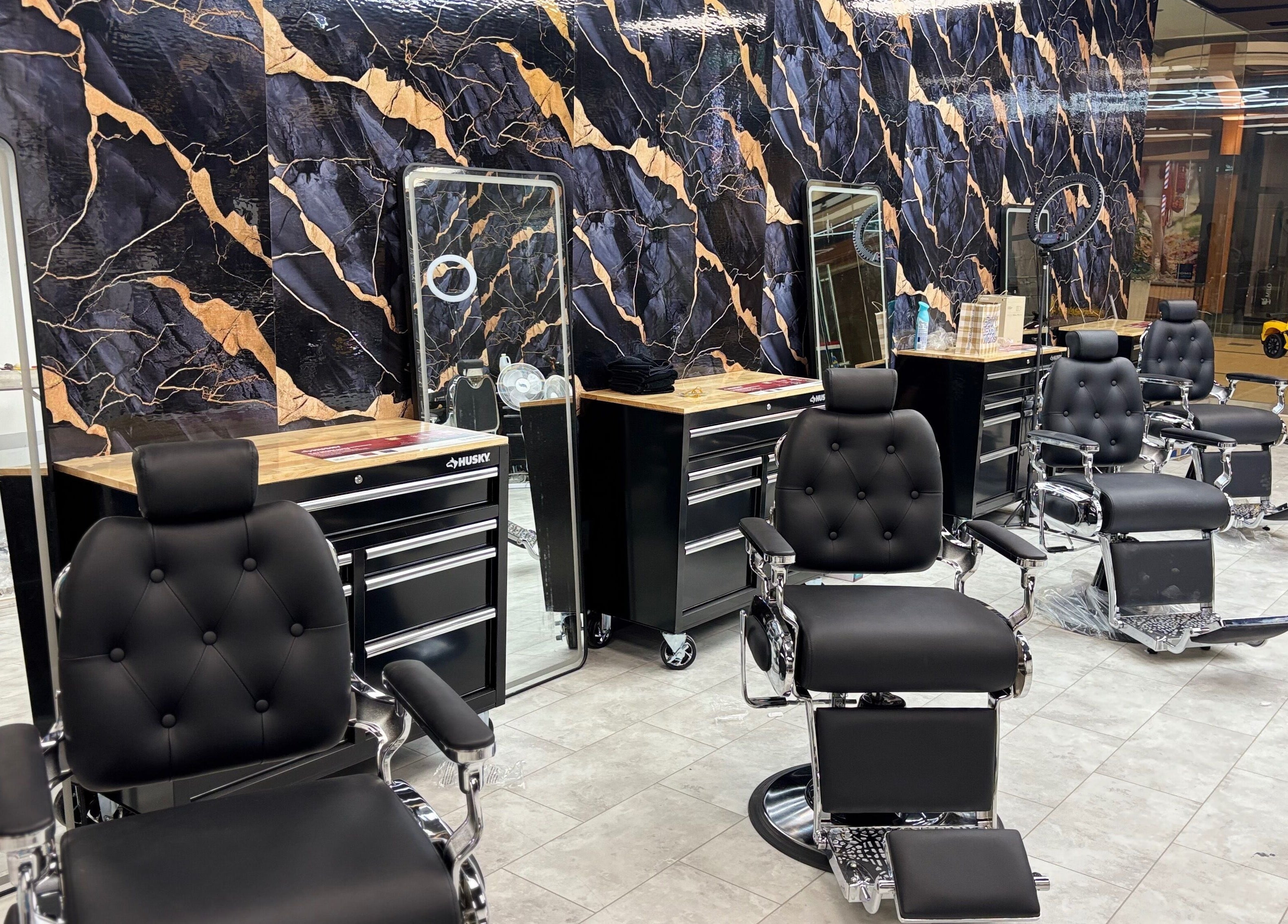 Sleek barber chairs at Bedford (Sunnyside Mall), Bedford, Nova Scotia, CA, offering a stylish grooming experience.