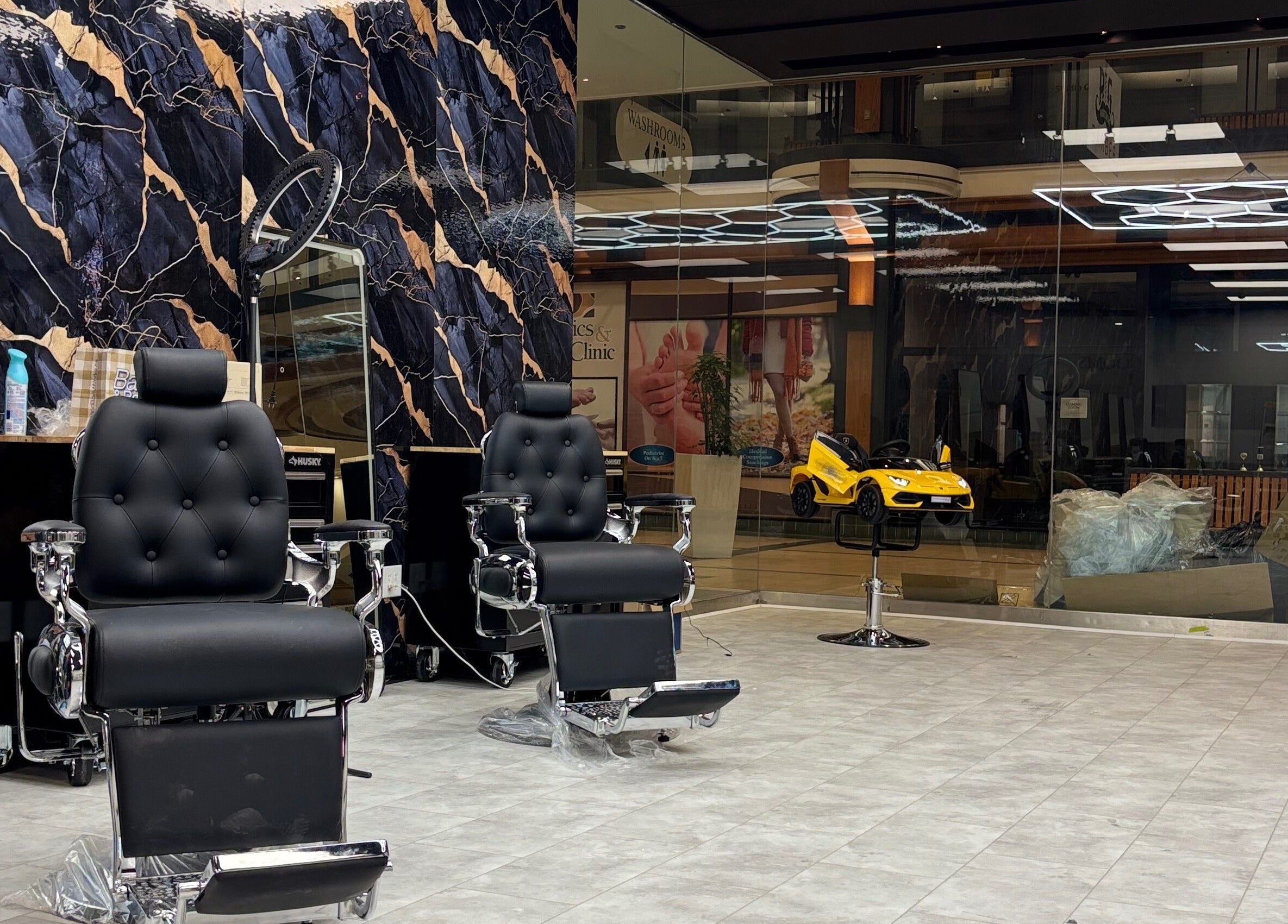 Elegant barber chairs at Bedford (Sunnyside Mall) salon in Bedford, Nova Scotia, CA with sophisticated decor.