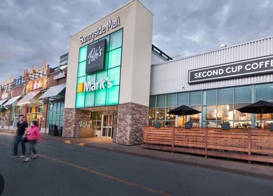 Entrance of Bedford (Sunnyside Mall) in Bedford, Nova Scotia, CA, featuring vibrant storefronts and modern design.