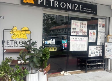 Petronize storefront in Singapore, SG showcasing pet care services with plant decorations.