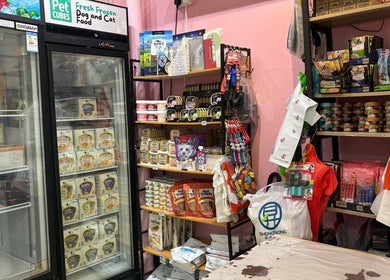 Pet supplies corner at Petronize, Singapore, SG stocked with various pet care products and food.