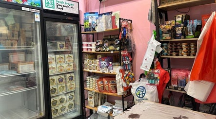 Pet supplies corner at Petronize, Singapore, SG stocked with various pet care products and food.