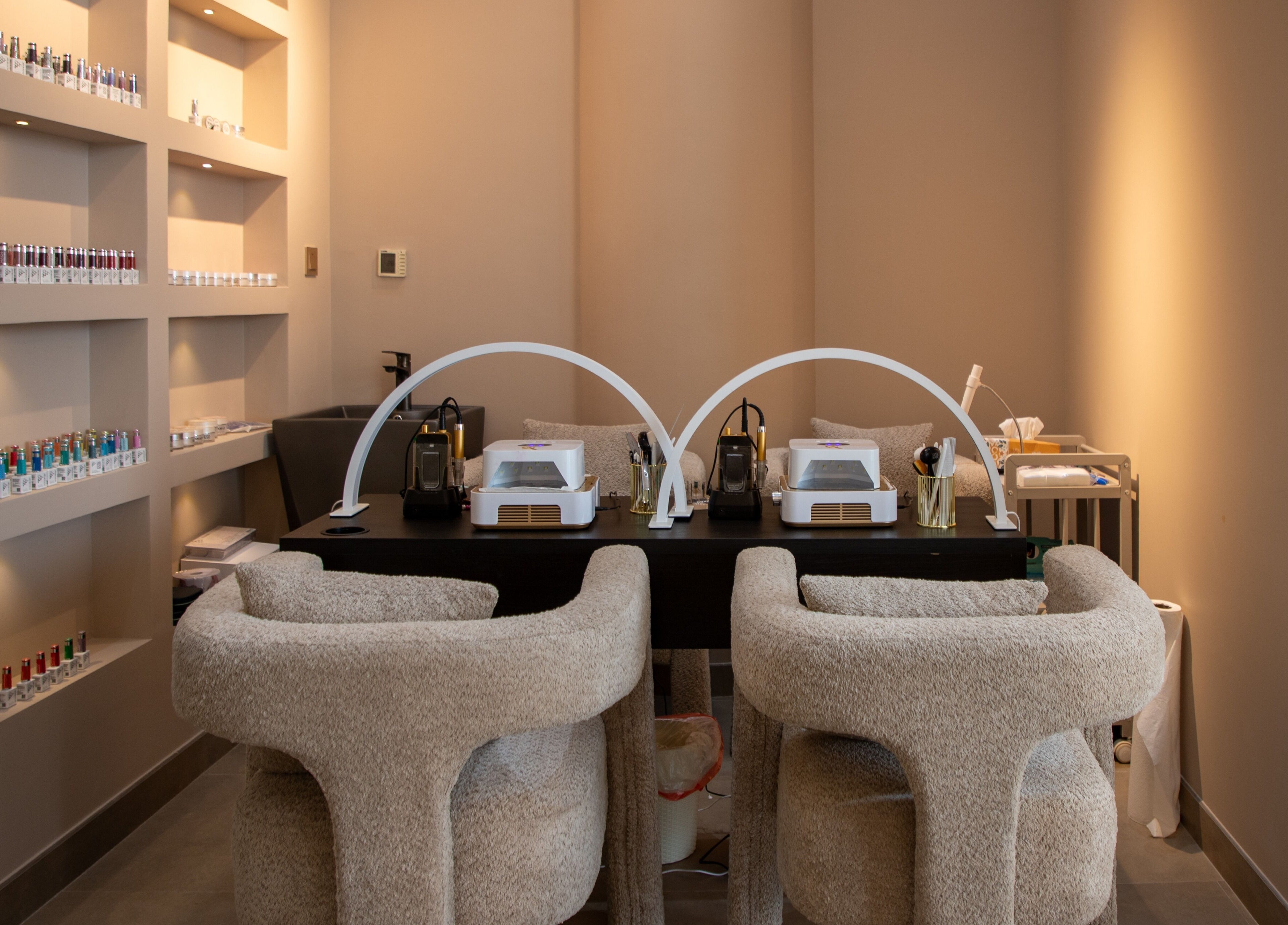 Elegant manicure station at So Chic Paris in Dubai, Dubai, AE showcasing modern design and nail polish display.