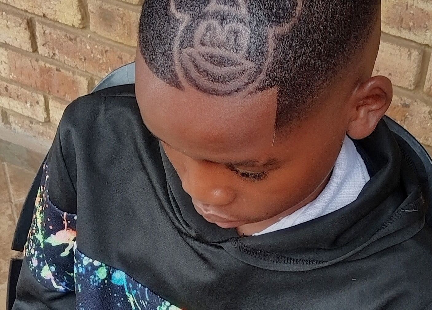 Creative haircut with unique design at Legacy, Midrand, Gauteng, ZA, showcasing detailed hair art.