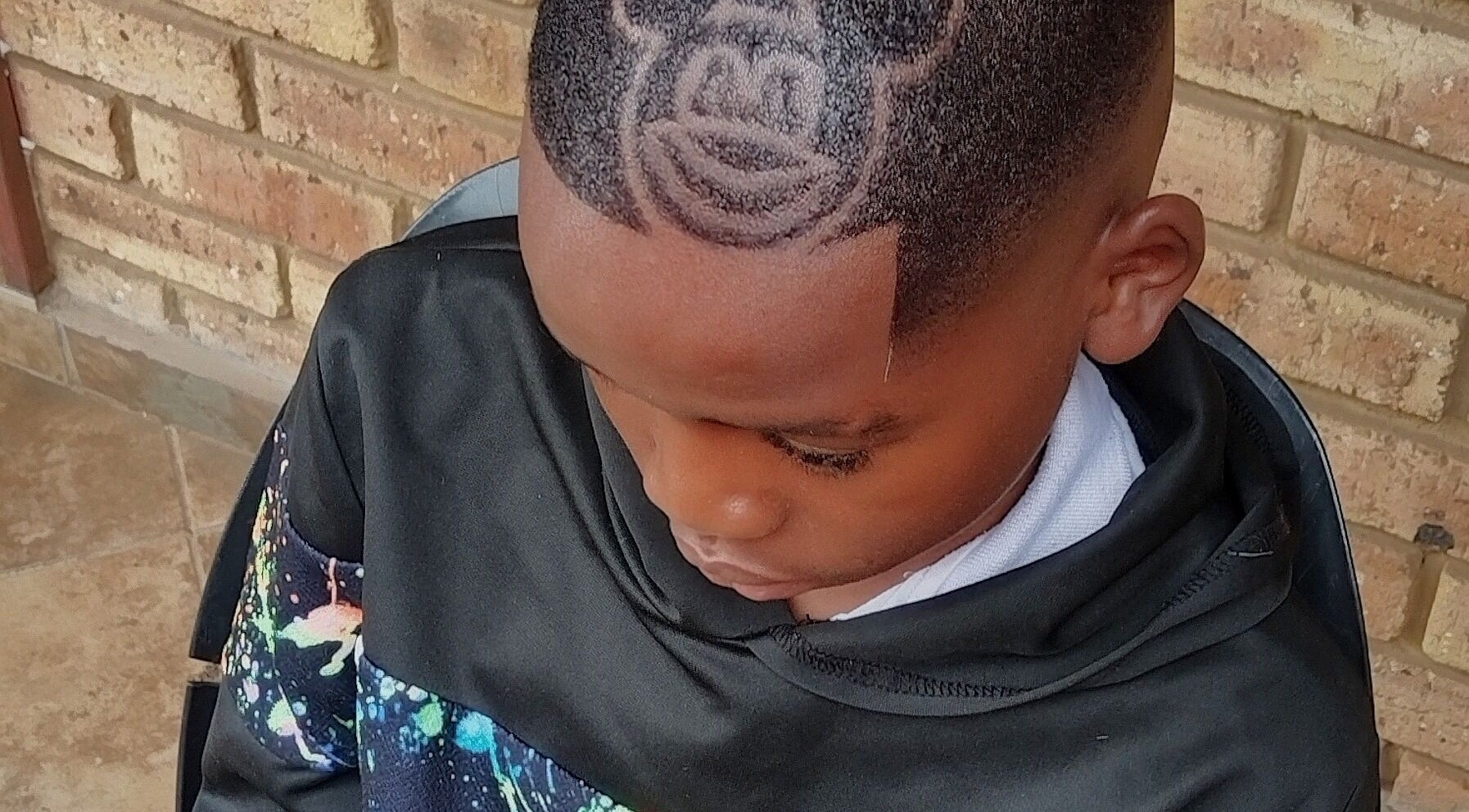 Creative haircut with unique design at Legacy, Midrand, Gauteng, ZA, showcasing detailed hair art.
