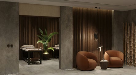 Relaxing interior of Sari Kayangan Spa & Wellness in Sepang, Selangor, MY with plush chairs and serene decor.