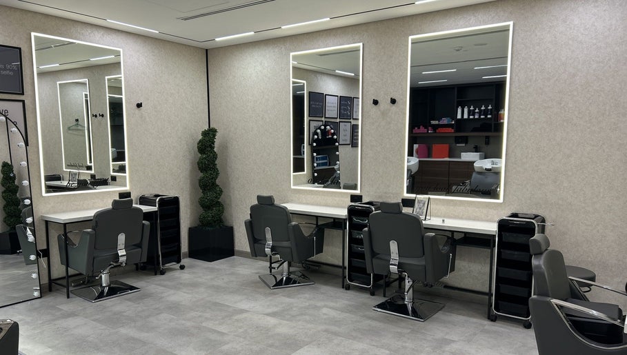 Elegant salon interior at Villa 8 Ladies Salon and Spa, Dubai, Dubai, AE, featuring stylish chairs and mirrors.