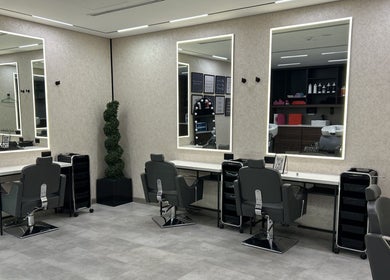 Elegant salon interior at Villa 8 Ladies Salon and Spa, Dubai, Dubai, AE, featuring stylish chairs and mirrors.