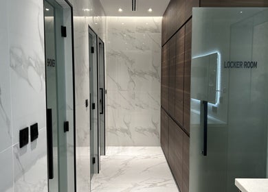 Locker room and shower at Villa 8 Ladies Salon and Spa, Dubai, Dubai, AE, with marble walls.