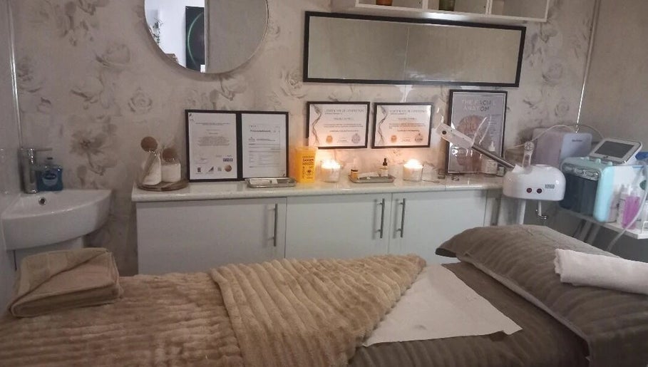 Relaxing treatment room at CKB Skin Clinic, Glasgow, Scotland, GB with soft lighting and skincare equipment.