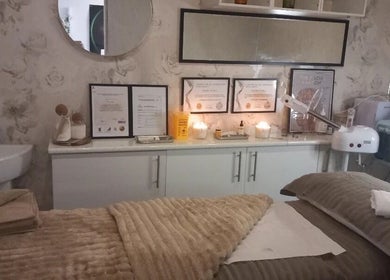 Relaxing treatment room at CKB Skin Clinic, Glasgow, Scotland, GB with soft lighting and skincare equipment.