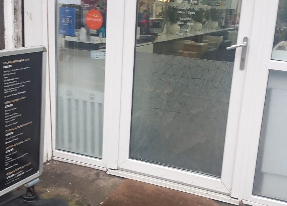 Entrance of CKB Skin Clinic with signage, Glasgow, Scotland, GB.