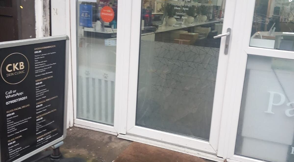 Entrance of CKB Skin Clinic with signage, Glasgow, Scotland, GB.