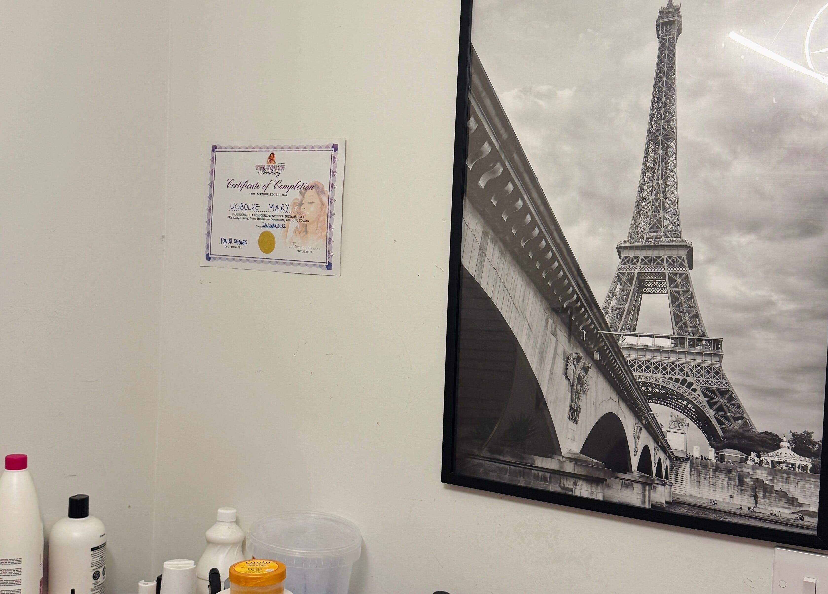 Certificate and Eiffel Tower artwork at Mimis Haven Hub LTD, Leeds, England, GB wellness salon.