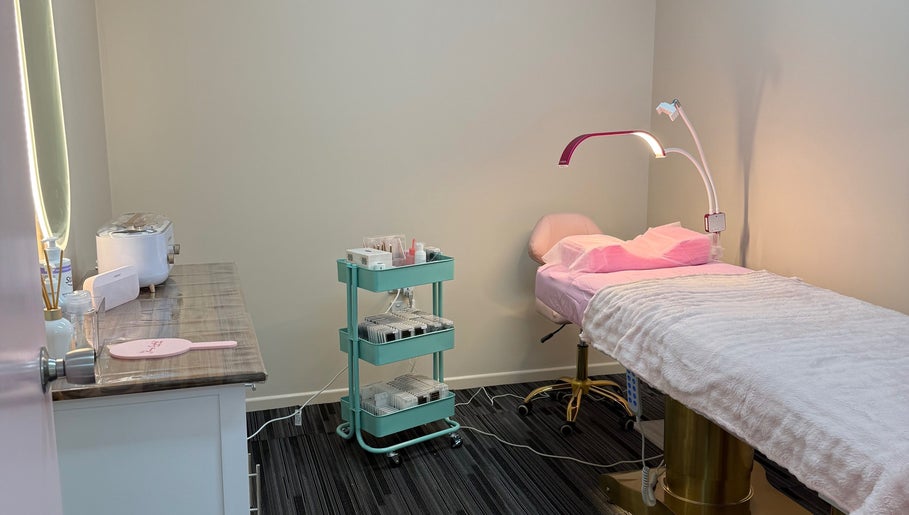 Cozy treatment room at Fancy Lashes TSV, Aitkenvale, Queensland, AU with a cushioned bed and serene lighting.