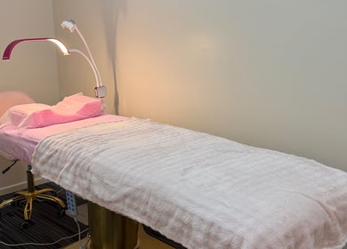 Cozy treatment room at Fancy Lashes TSV, Aitkenvale, Queensland, AU with soft pink linens.