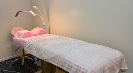 Cozy treatment room at Fancy Lashes TSV, Aitkenvale, Queensland, AU with soft pink linens.
