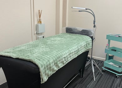 Cozy treatment room at Fancy Lashes TSV in Aitkenvale, Queensland, AU, featuring a plush bed and modern decor.