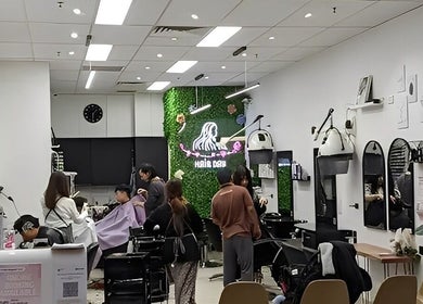 Interior of Hair Day salon in Victoria Park, Western Australia, AU showcasing chic decor and styling stations.