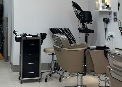 Modern salon interior at Hair Day in Victoria Park, Western Australia, AU, showcasing stylish salon chairs.