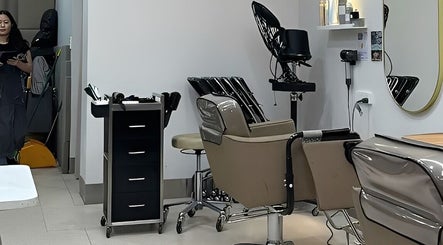 Modern salon interior at Hair Day in Victoria Park, Western Australia, AU, showcasing stylish salon chairs.