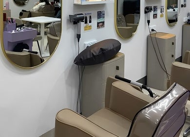 Modern salon at Hair Day, Victoria Park, Western Australia, AU with mirrors and chic styling chairs.