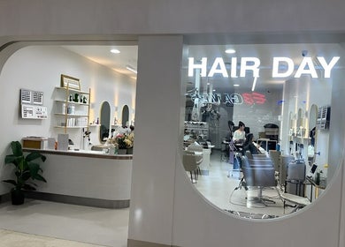 Stylish interior of Hair Day salon in Victoria Park, Western Australia, AU with modern decor and seating.
