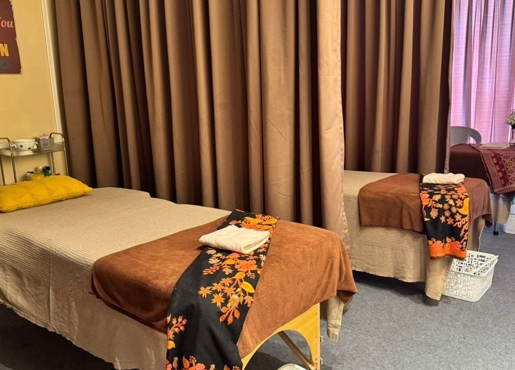 Cozy treatment room at Bidan Cantik Spa in Sungai Petani, Kedah, MY with warm decor and massage beds.