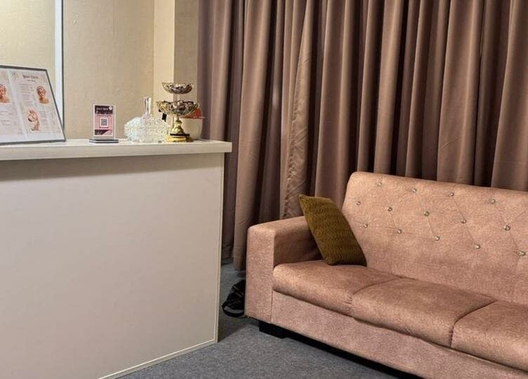 Welcoming reception area of Bidan Cantik Spa in Sungai Petani, Kedah, MY with a plush sofa and decor.