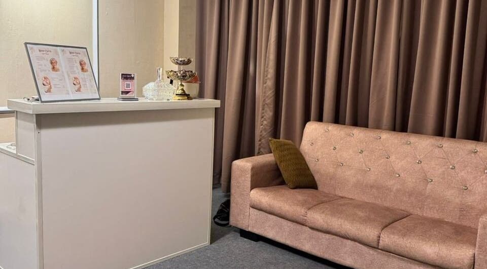 Welcoming reception area of Bidan Cantik Spa in Sungai Petani, Kedah, MY with a plush sofa and decor.