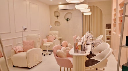 Modern interior of Blooming Nails Beauty Studio in Bacoor, Calabarzon, PH, featuring plush chairs and sleek decor.