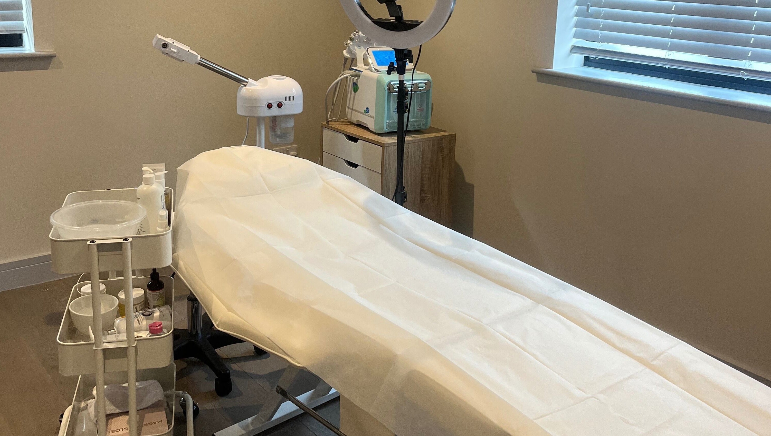 Treatment room at Skin Space, Stevenage, England, GB, featuring a comfortable treatment bed.