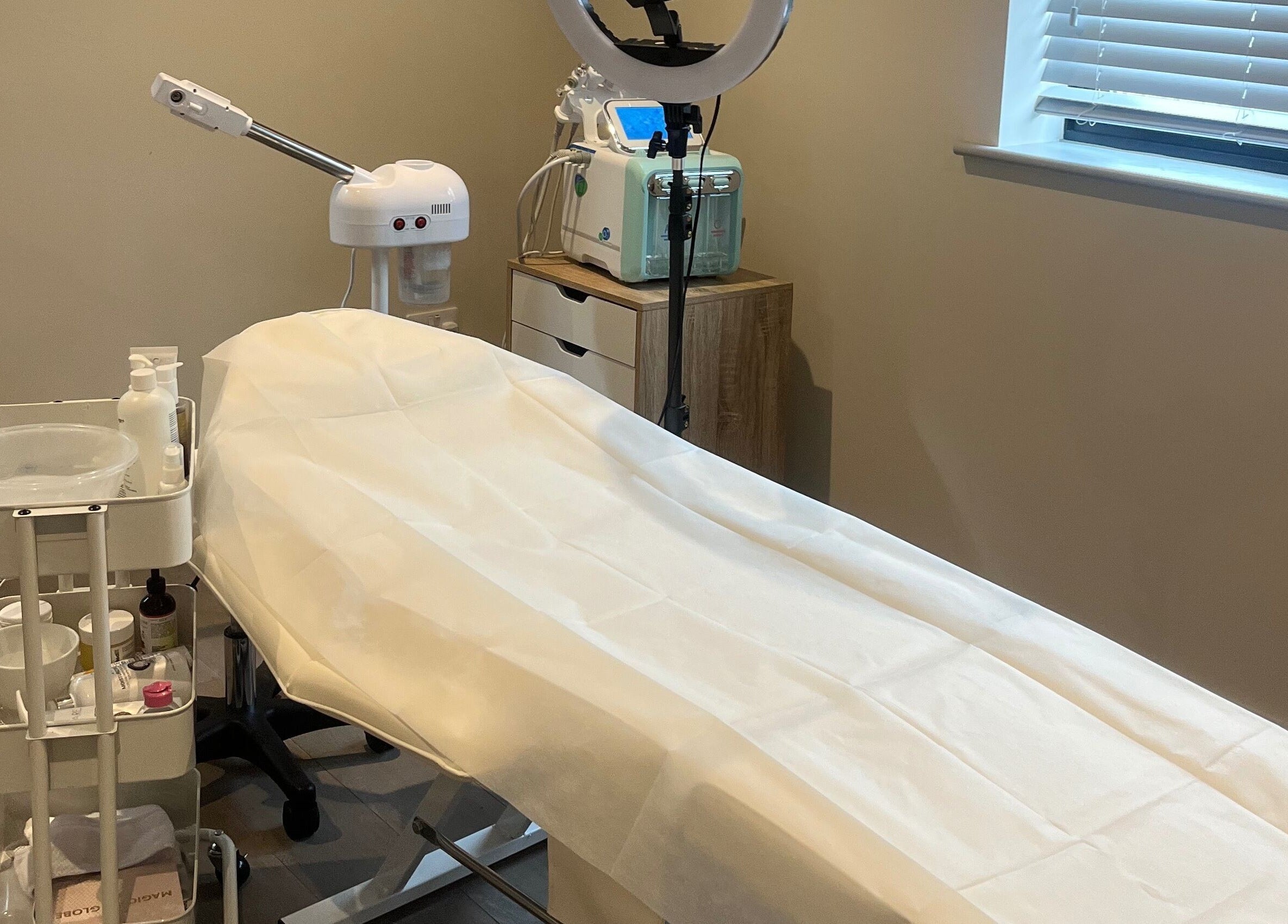 Treatment room at Skin Space, Stevenage, England, GB, featuring a comfortable treatment bed.