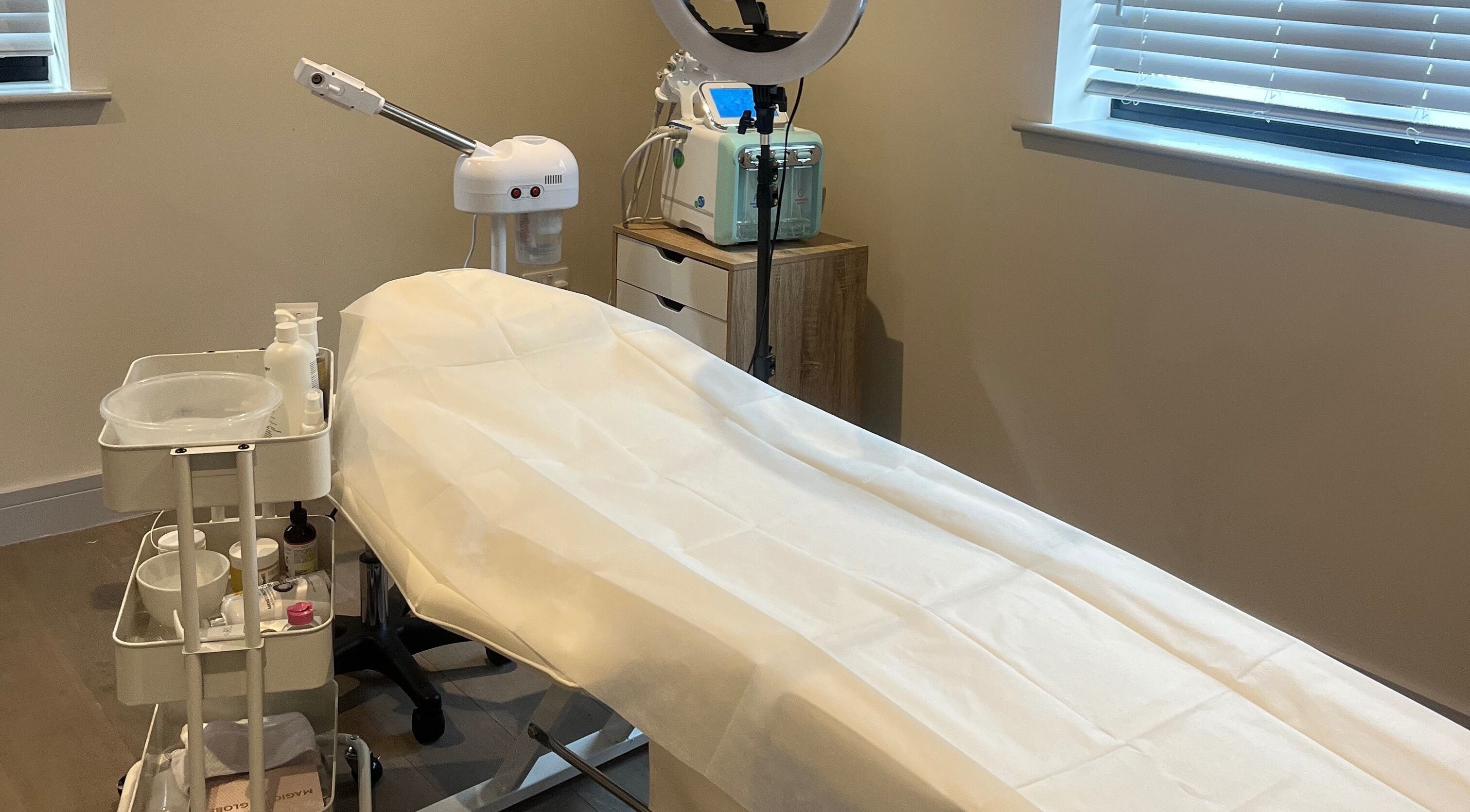 Treatment room at Skin Space, Stevenage, England, GB, featuring a comfortable treatment bed.