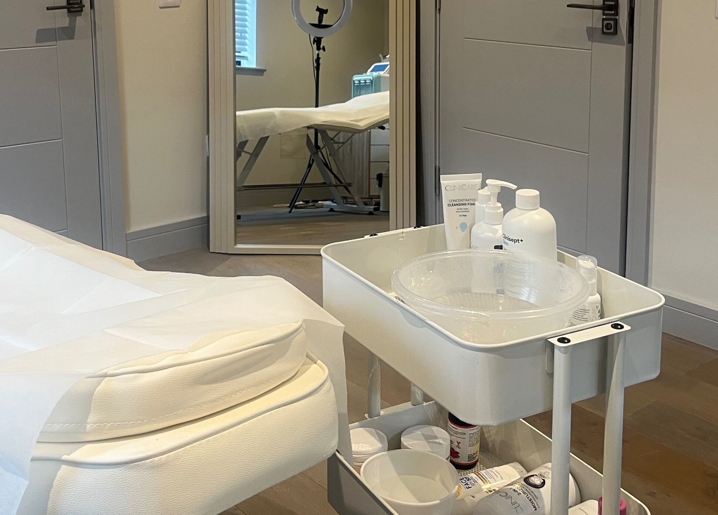Relaxing treatment room at Skin Space in Stevenage, England, GB with a clean bed and skincare products.