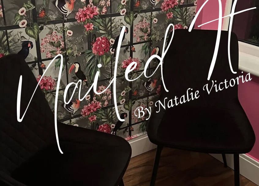 Elegant seating area at Nailed It by Natalie Victoria, Doncaster, England, GB with floral wall design.