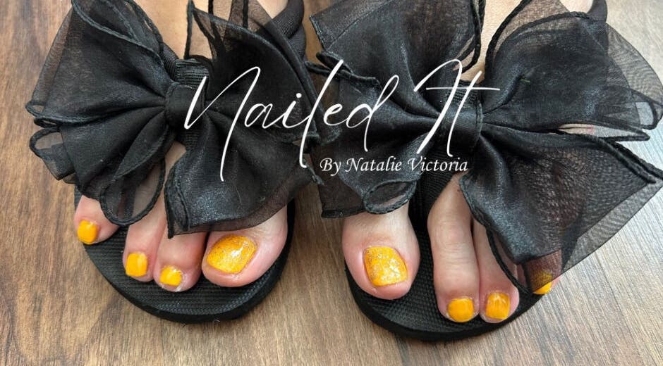 Yellow pedicure with black bows at Nailed It by Natalie Victoria, Doncaster, England, GB.
