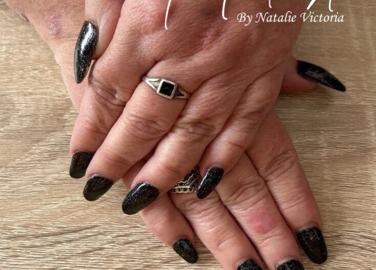 Stylish black manicured hands at Nailed It by Natalie Victoria, Doncaster, England, GB.