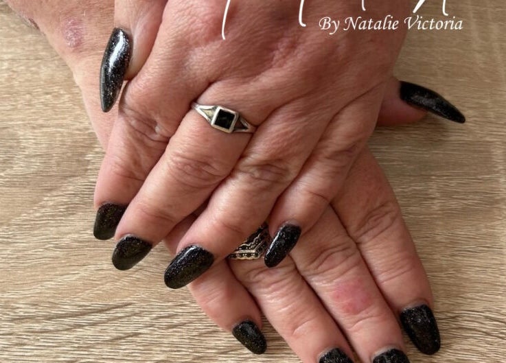 Stylish black manicured hands at Nailed It by Natalie Victoria, Doncaster, England, GB.