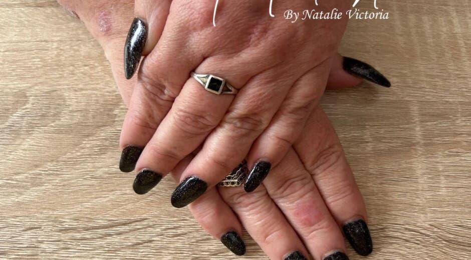 Stylish black manicured hands at Nailed It by Natalie Victoria, Doncaster, England, GB.