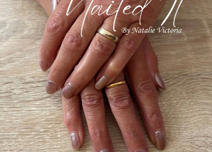 Elegant gel manicure at Nailed It by Natalie Victoria in Doncaster, England, GB, showcasing shimmer polish.