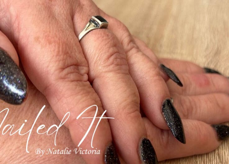 Elegant black glitter nails at Nailed It by Natalie Victoria, Doncaster, England, GB.