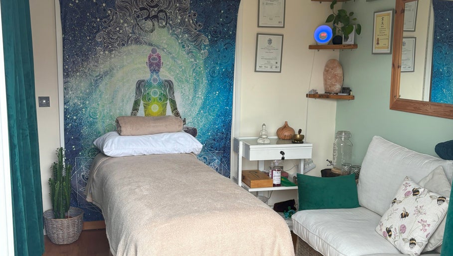 Tranquil therapy room at Bee Elevated Holistic Health, Holbury, England with soothing decor and comfortable seating.