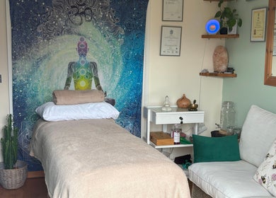 Tranquil therapy room at Bee Elevated Holistic Health, Holbury, England with soothing decor and comfortable seating.
