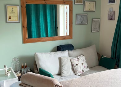 Relaxing therapy room at Bee Elevated Holistic Health, Holbury, England, GB with cozy decor.