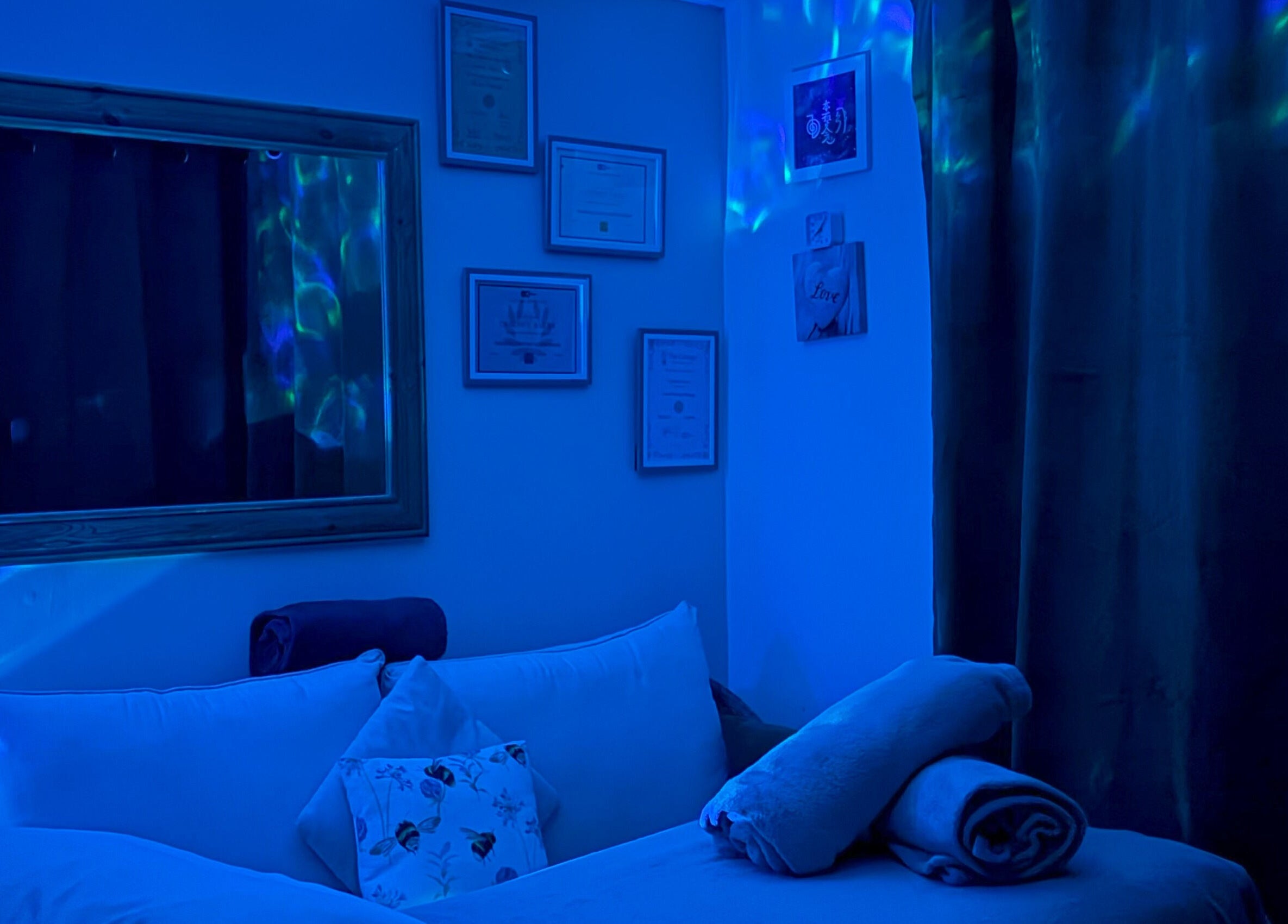 Tranquil therapy room at Bee Elevated Holistic Health in Holbury, England, GB with soothing blue lighting.
