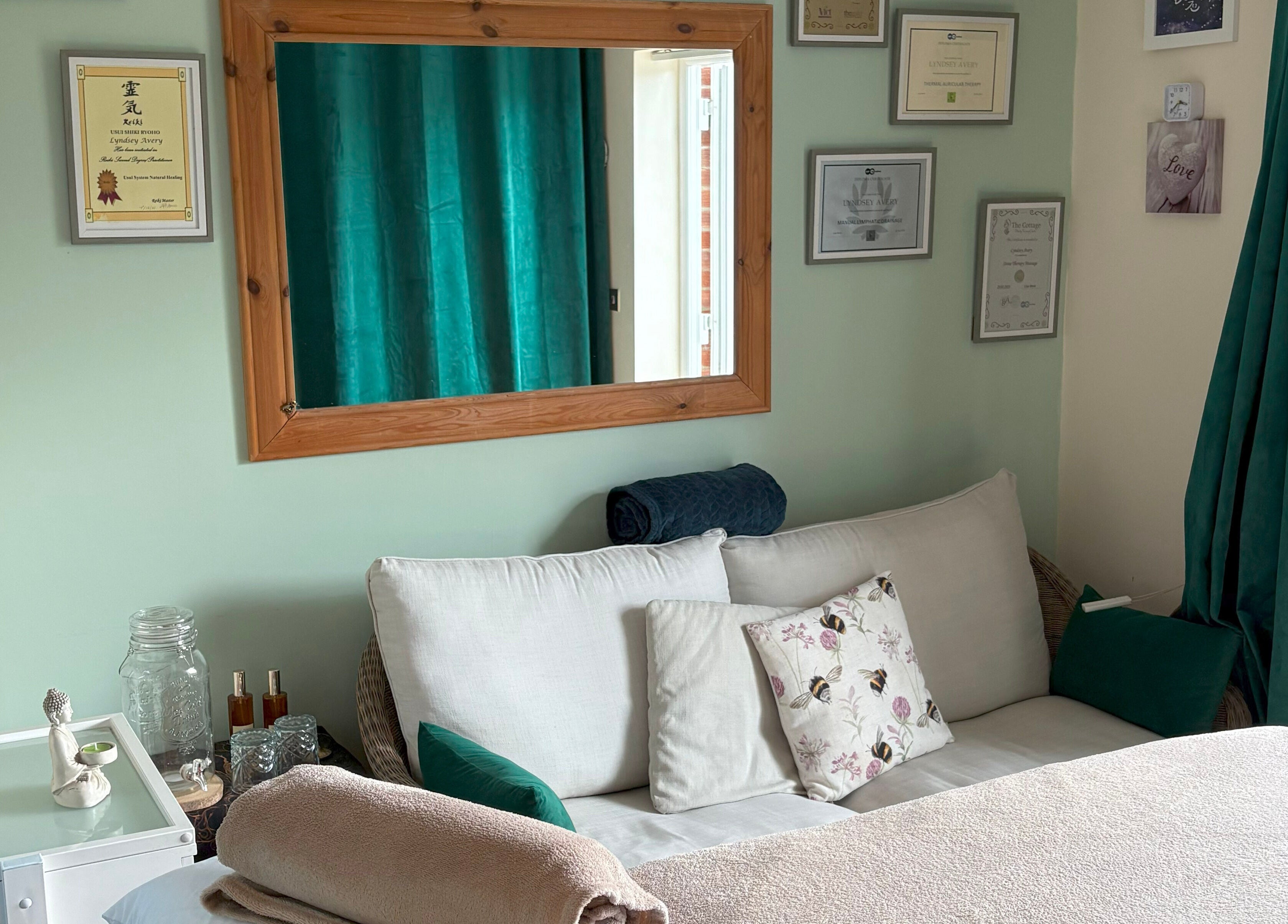 Cozy seating area at Bee Elevated Holistic Health, Holbury, England, GB with pillows and tranquil decor.