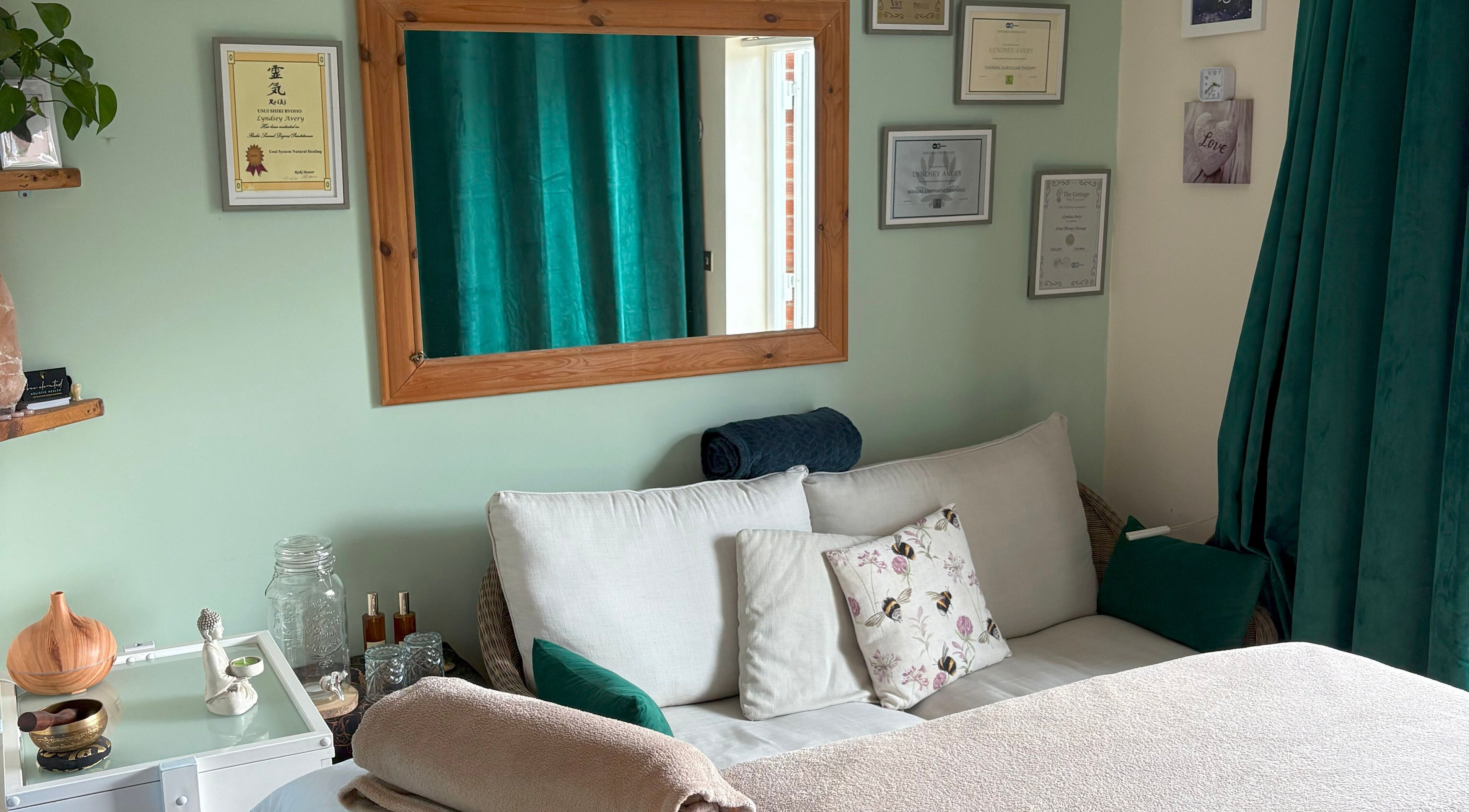 Cozy seating area at Bee Elevated Holistic Health, Holbury, England, GB with pillows and tranquil decor.