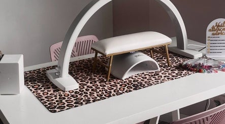 Stylish nail station at Beautybycodz in Methil, Scotland, GB with leopard print mat and nail color samples.