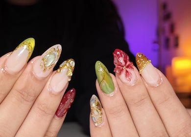 Elegant nail art designs at Yorrnails, Melbourne, Victoria, AU, showcasing vibrant colors and intricate patterns.